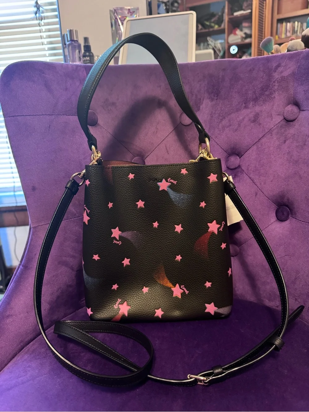 Coach Black Leather Bucket Bag with Pink Star Print